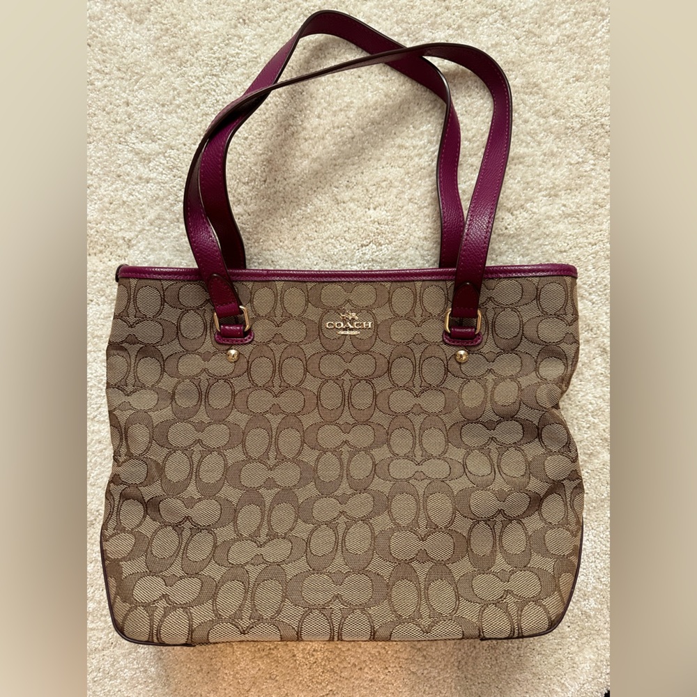 Brown coach purse with burgundy accents